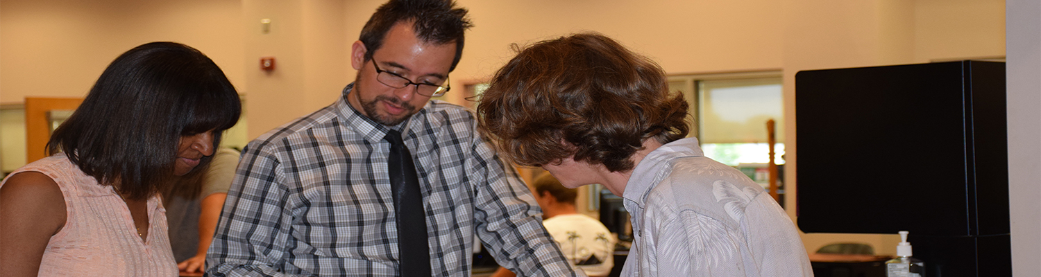 Student with Advisers in the Student Services 1 Stop