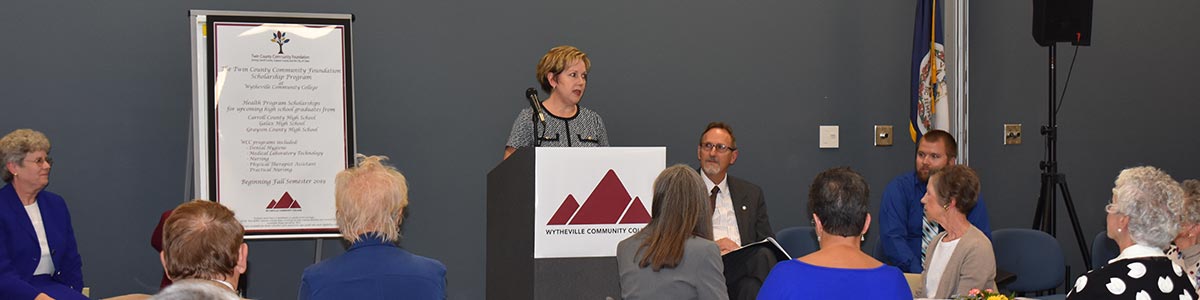 Executive director announcing the new Twin County scholarship program