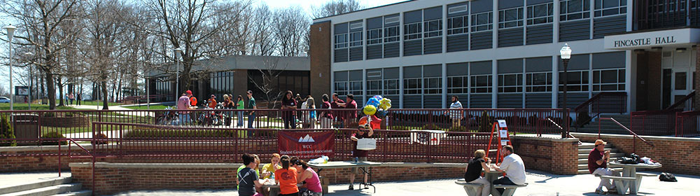 Students on the quad and in the patio seating area