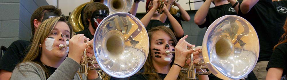 Students playing horns in the Pep Band