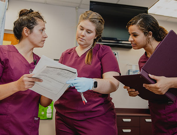 3 nursing students at WCC practicing clinical.