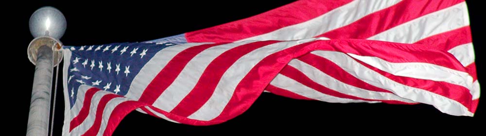 American flag waving on flag pole